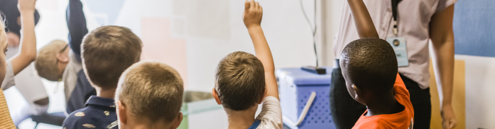 Children raising their hands